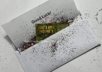 You can choose to add glitter to your fake lottery scratch off ticket mail prank.