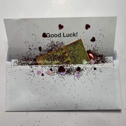 Show someone some love by adding glitter and heart confetti to your fake lottery scratcher mail prank.